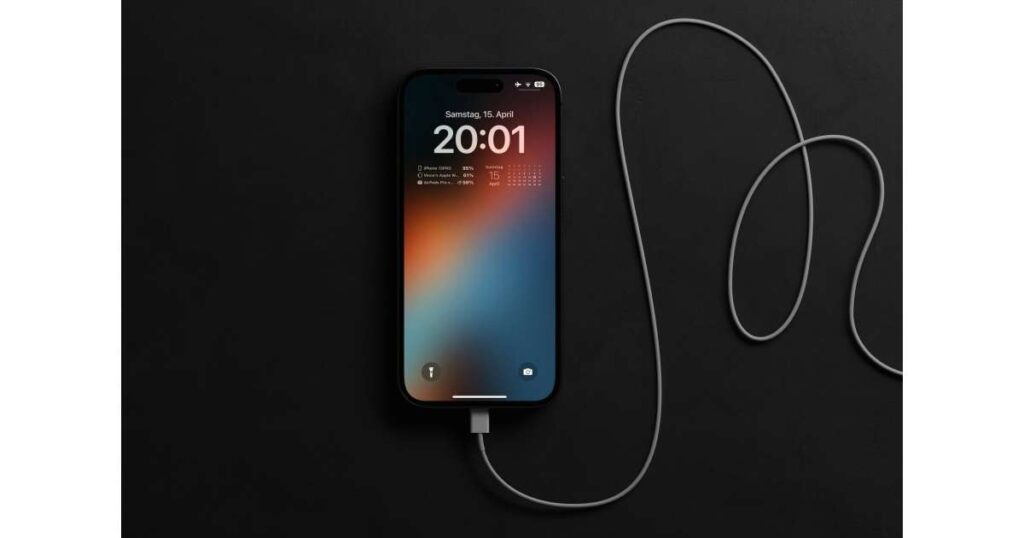 
An iphone is plugged into a charger